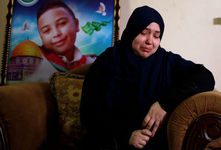 Eman, the mother of Palestinian boy, Hussein Madi, who was killed at the Israel-Gaza border, weeps during an interview with Reuters at her house in Gaza City April 9, 2018. REUTERS/Mohammed Salem