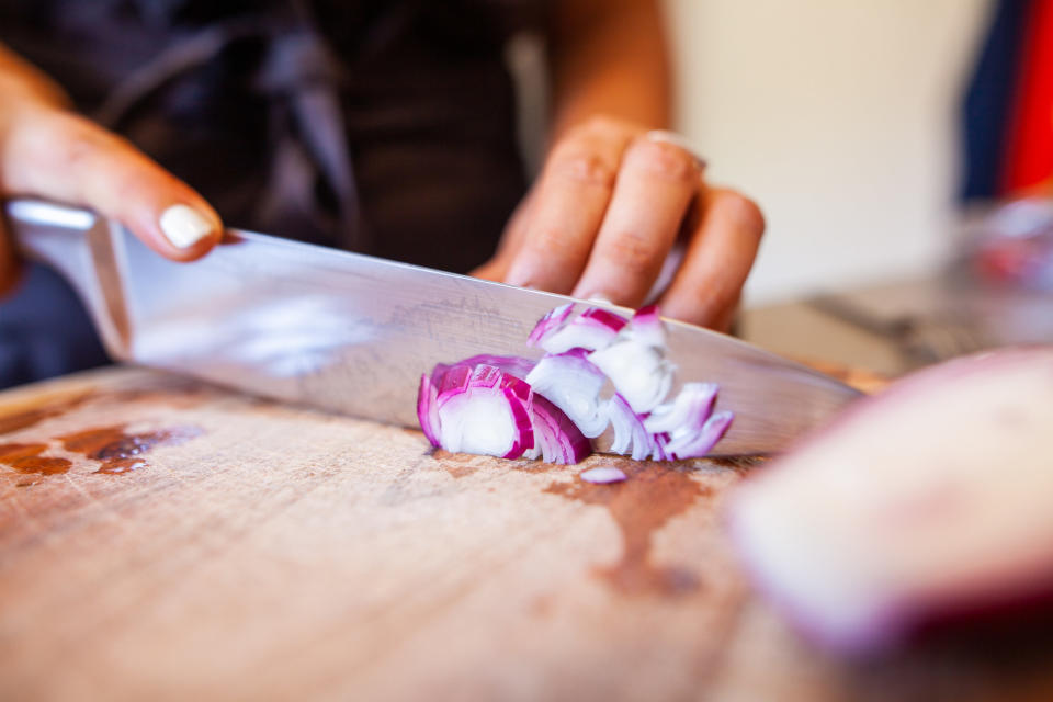 Slicing a shallot.