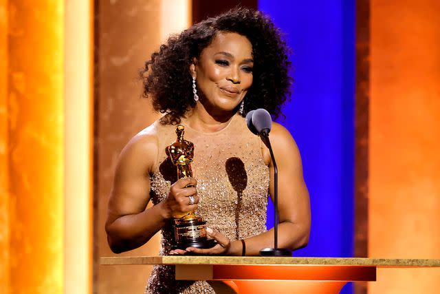 <p>Kevin Winter/Getty Images</p> Angela Bassett receives an Honorary Oscar at the 14th Governors Awards in Los Angeles on Jan. 9, 2024