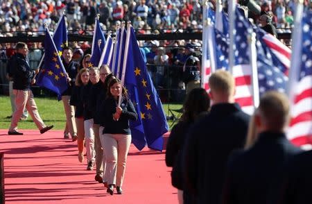 Sep 29, 2016; Chaska, MN, USA; The flags of Europe and the United States are paraded in during the Opening Ceremony for the 41st Ryder Cup at Hazeltine National Golf Club. Mandatory Credit: Rob Schumacher-USA TODAY Sports - RTSQ3Y2