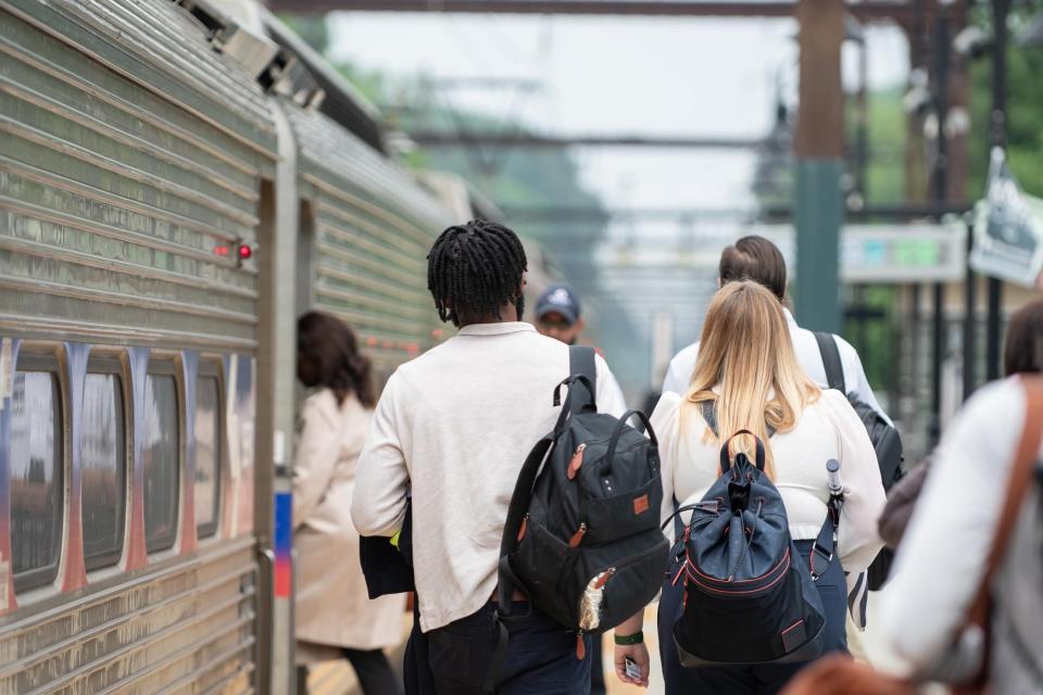 Passengers board a southbound train on SEPTA's West Trenton regional rail line at the Yardley station on Monday, June 12, 2023.