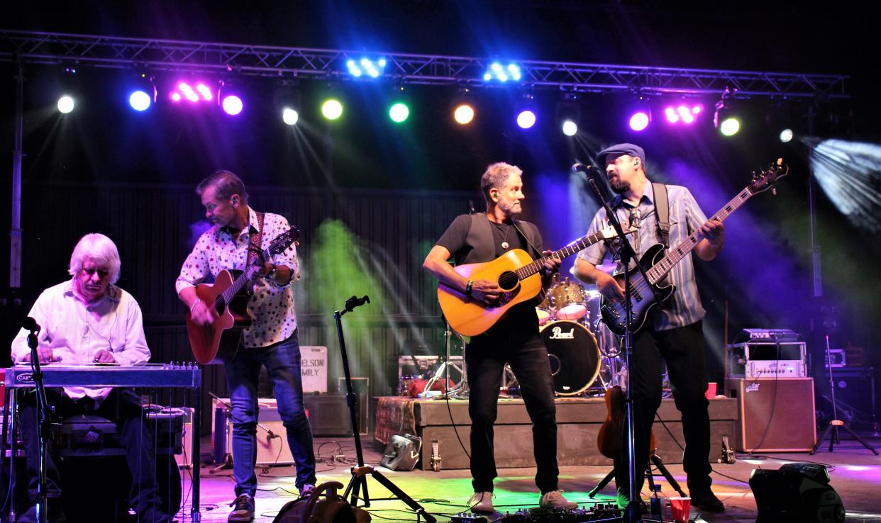 From left, John David Call, Randy Harper, Jeff Zona and Jared Camic jam on stage during Pure Prairie League's gig Saturday at Lime Rock Amphitheatre. They closed the show with the classic "Amie."