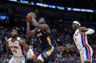 New Orleans Pelicans forward Zion Williamson (1) goes to the basket between Detroit Pistons forward Saddiq Bey (41) and center Jalen Duren (0) in the first half of an NBA basketball game in New Orleans, Wednesday, Dec. 7, 2022. (AP Photo/Gerald Herbert)