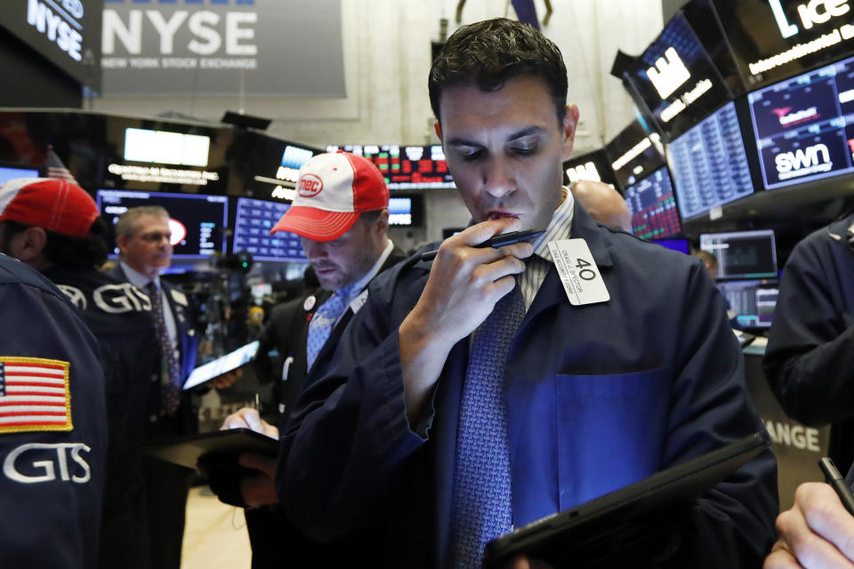Traders on the floor of the New York Stock Exchange. Photo: Richard Drew/AP