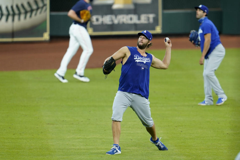 Los Angeles Dodgers pitcher Clayton Kershaw throws during batting practice before a baseball game against the Houston Astros Wednesday, July 29, 2020, in Houston. (AP Photo/David J. Phillip)