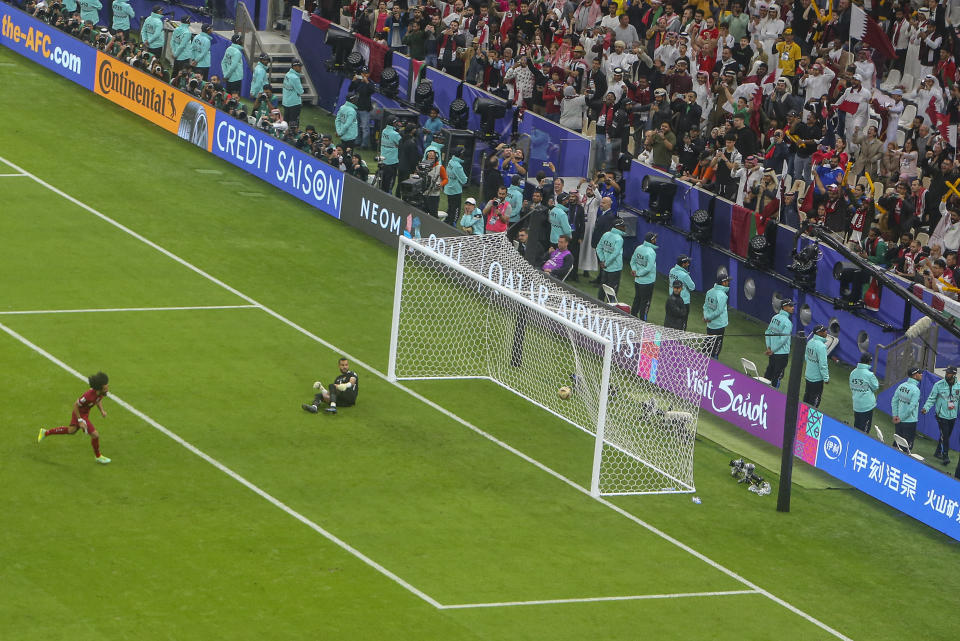 Qatar's Akram Afif scores a goal from the penalty spot during the Asian Cup final soccer match between Qatar and Jordan at the Lusail Stadium in Lusail, Qatar, Saturday, Feb. 10, 2024. (AP Photo/Hussein Sayed)