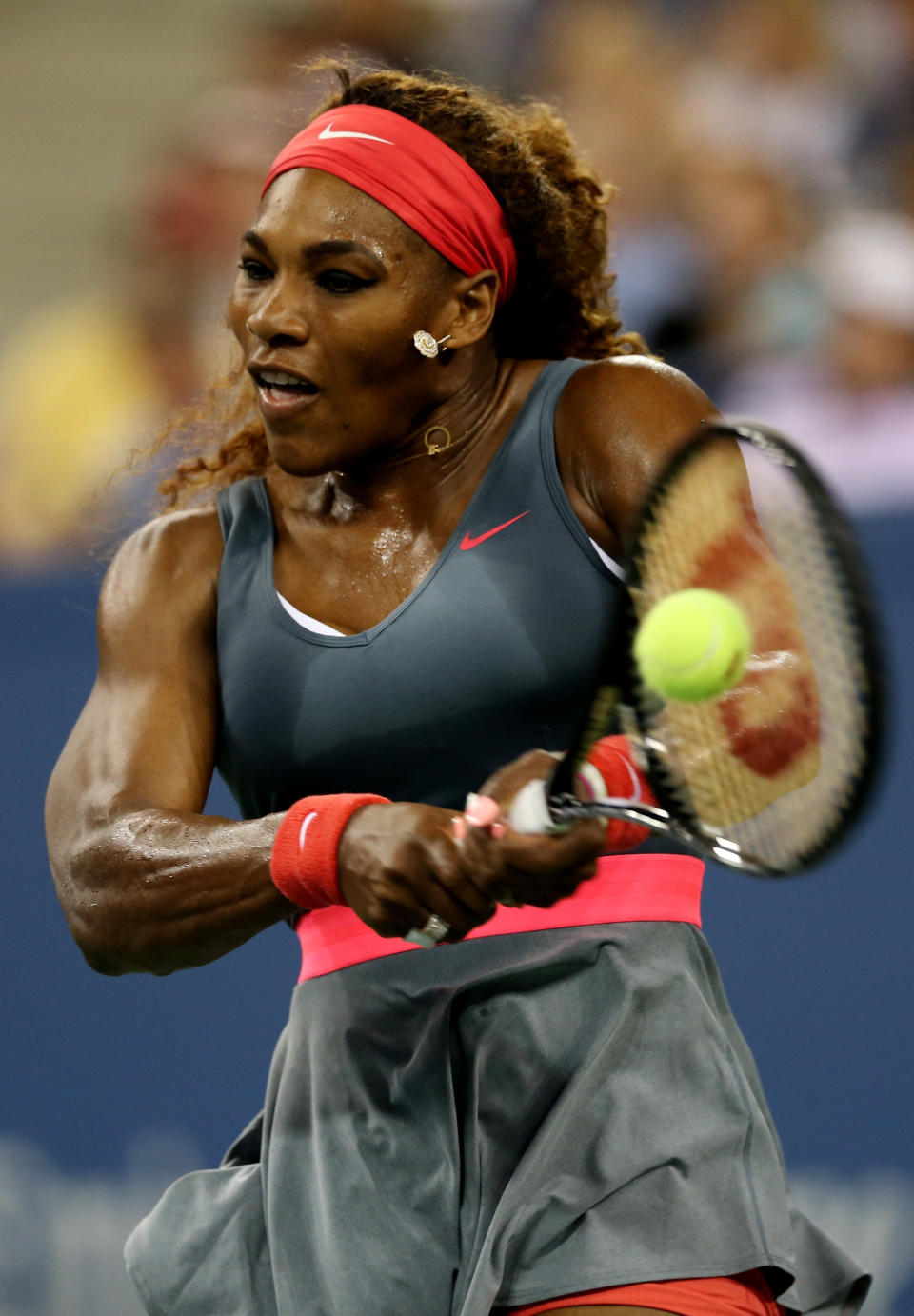 NEW YORK, NY - AUGUST 26:  Serena Williams of the United States of America plays a backhand against Francesca Schiavone of Italy during their women's singles first round match on Day One of the 2013 US Open at USTA Billie Jean King National Tennis Center on August 26, 2013 in the Flushing neighborhood of the Queens borough of New York City.  (Photo by Matthew Stockman/Getty Images)