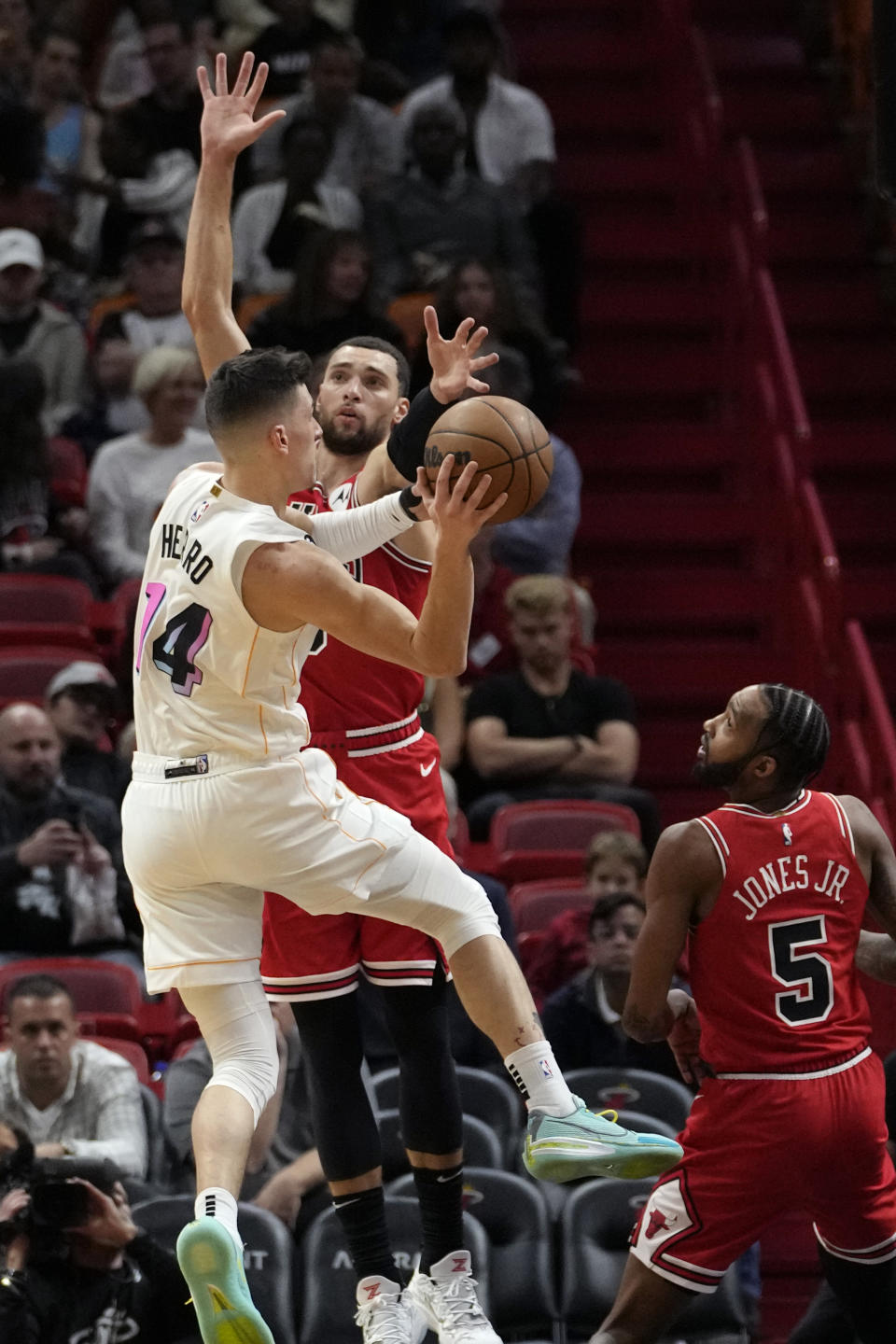 Chicago Bulls guard Zach LaVine, right, defends Miami Heat guard Tyler Herro (14) during the first half of an NBA basketball game, Tuesday, Dec. 20, 2022, in Miami. (AP Photo/Lynne Sladky)