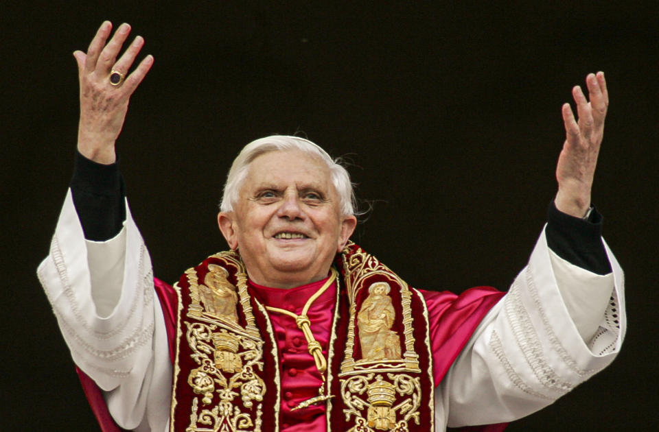 FILE - Pope Benedict XVI greets the crowd from the central balcony of St. Peter's Basilica at the Vatican on April 19, 2005, soon after his election. Pope Emeritus Benedict XVI, the German theologian who will be remembered as the first pope in 600 years to resign, has died, the Vatican announced Saturday. He was 95. (AP Photo/Andrew Medichini, File)