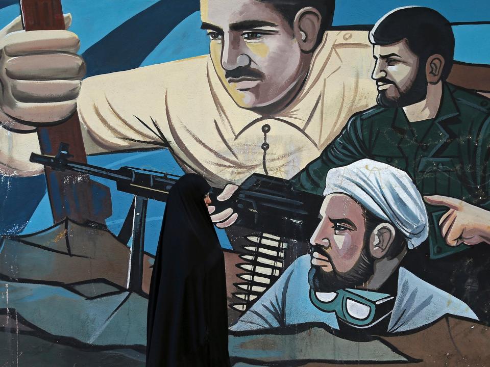 A mural in Tehran depicts members of the Basij – a force of several million volunteers: AP