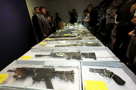 Air rifles seized along with explosives are displayed during a news conference at police headquarters in Hong Kong, China June 15, 2015. REUTERS/Bobby Yip