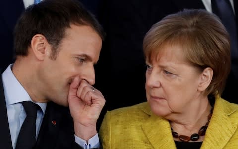 A Merkel departure would leave the door open to Mr Macron becoming Europe's de facto leader - Credit: YVES HERMAN/ Reuters