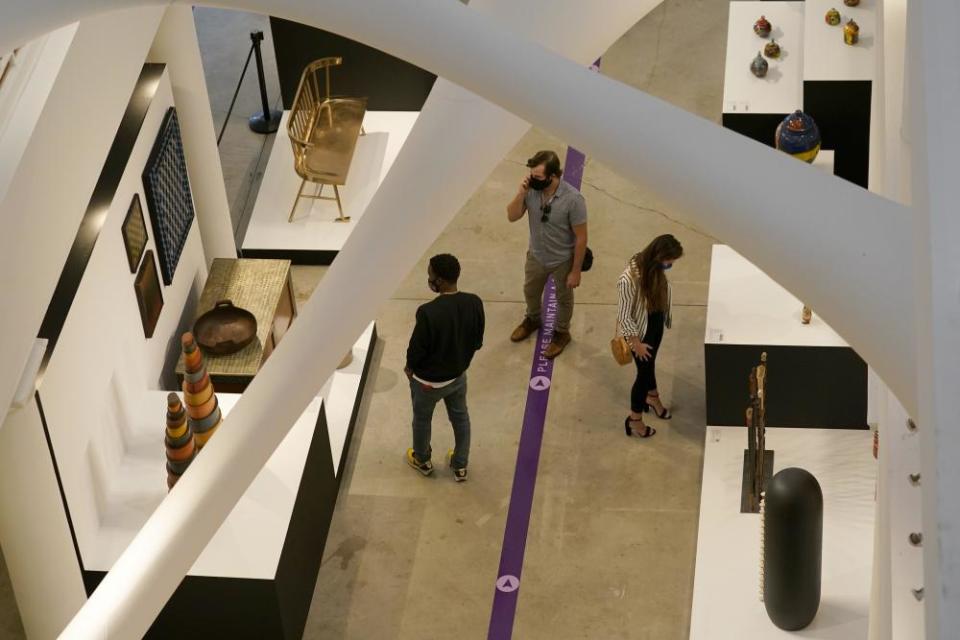 Attendees at the Design Miami exhibit in the Moore Building.