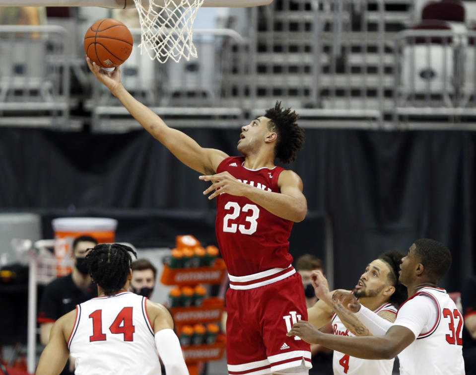 Indiana forward Trayce Jackson-Davis (23) goes up for a shot against Ohio State forward Justice Sueing (14), guard Duane Washington (4) and forward E.J. Liddell (32) during the first half of an NCAA college basketball game in Columbus, Ohio, Saturday, Feb. 13, 2021. (AP Photo/Paul Vernon)