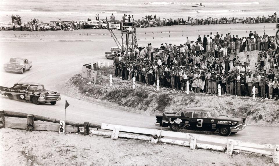 Eventual winner Paul Goldsmith works the north turn of the old Daytona beach-and-road course during the final beach race, in 1958.