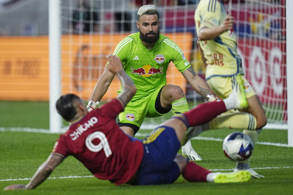 New York Red Bulls goalkeeper Carlos Miguel Coronel, rear, defends against Real Salt Lake's Chicho (9) during the second half of an MLS soccer match Saturday, July 15, 2023, in Sandy, Utah. (AP Photo/Rick Bowmer)