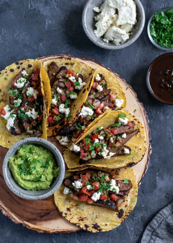 <p>The Curious Chickpea</p><p>The juicy seared seitan carne asada is thinly sliced then piled into warm corn tortillas and topped with pico de gallo, vegan queso fresco and minced cilantro to serve.</p><p><strong>Get the recipe: <a href="https://www.thecuriouschickpea.com/vegan-seitan-carne-asada-tacos/" rel="nofollow noopener" target="_blank" data-ylk="slk:Vegan Seitan Carne Asada Tacos;elm:context_link;itc:0;sec:content-canvas" class="link ">Vegan Seitan Carne Asada Tacos</a></strong></p>