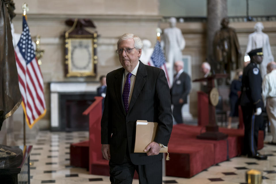 Senate Minority Leader Mitch McConnell, R-Ky., heads to the chamber for the final vote on a $280 billion bill designed to boost the U.S. semiconductor industry and to accelerate high tech research that backers say will be critical to the economy in future decades, at the Capitol in Washington, Wednesday, July 27, 2022. (AP Photo/J. Scott Applewhite)