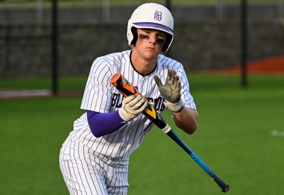 Bloomington South’s Luke Thompson celebrates after drawing a walk during the baseball game against Bloomington North at South on Thursday, April 25, 2024.