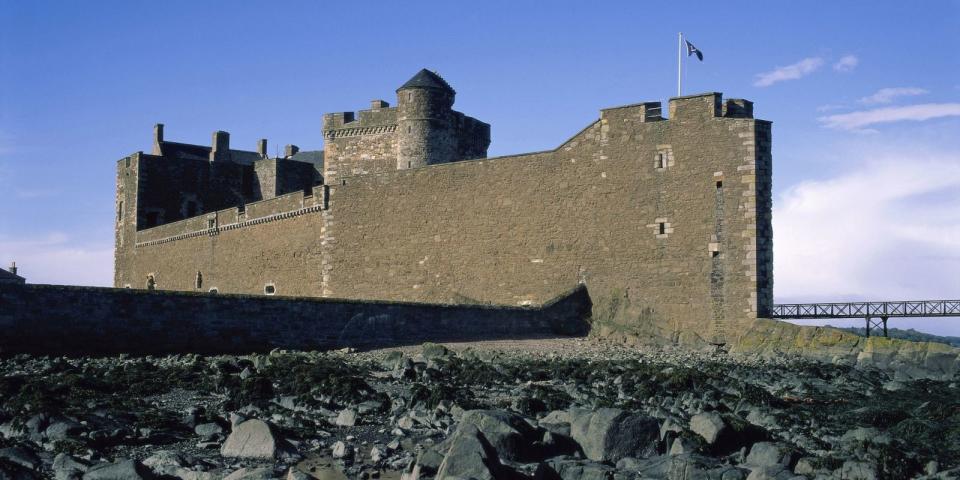 <p><strong><strong>You'll recognise it as:</strong> </strong>Fort William</p><p>This 15th-century fortress doubles as Black Jack Randall's Fort William, where Jamie is flogged in season one. <a rel="nofollow noopener" href="https://www.tripadvisor.co.uk/Attraction_Review-g186525-d2365244-Reviews-Blackness_Castle-Edinburgh_Scotland.html" target="_blank" data-ylk="slk:Blackness Castle;elm:context_link;itc:0;sec:content-canvas" class="link ">Blackness Castle</a> got the nickname "the ship that never sailed" because of how much it is shaped like a ship.</p>