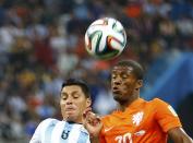 Argentina's Enzo Perez (L) fights for the ball with Georginio Wijnaldum of the Netherlands during their 2014 World Cup semi-finals at the Corinthians arena in Sao Paulo July 9, 2014. REUTERS/Darren Staples (BRAZIL - Tags: SOCCER SPORT WORLD CUP)