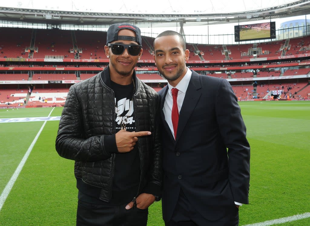 Lewis Hamilton and Theo Walcott in 2014  (Arsenal FC via Getty Images)