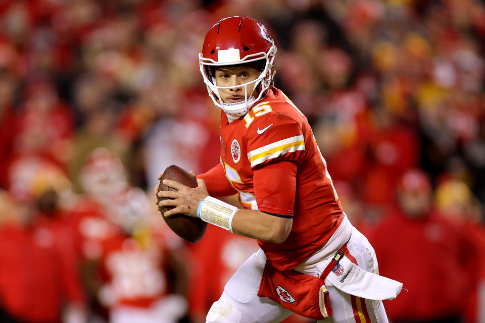 Patrick Mahomes about to throw a football.