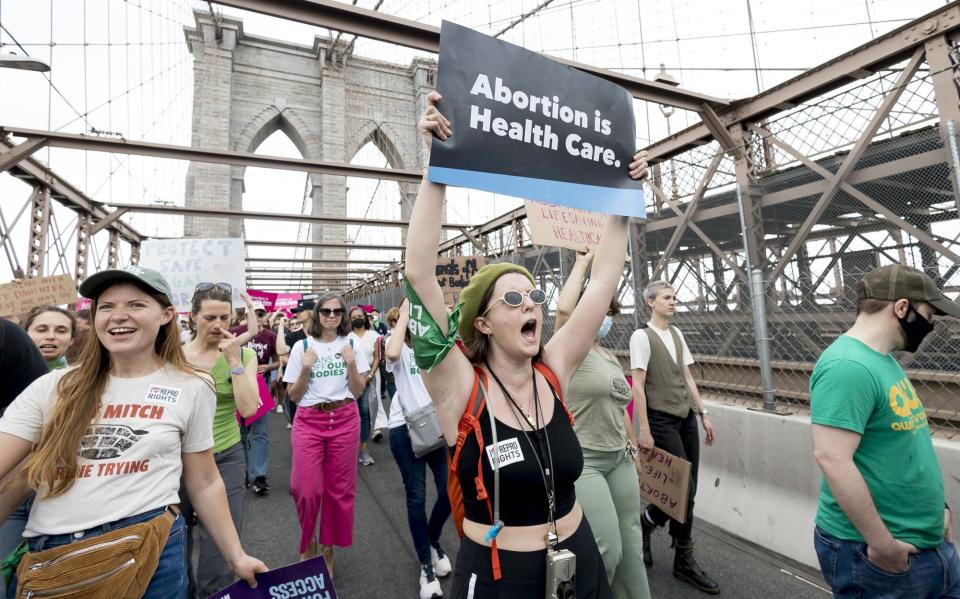 Mandatory Credit: Photo by JUSTIN LANE/EPA-EFE/Shutterstock (12940200c) People march over the Brooklyn Bridge as part of nationwide protests begin held for abortion rights in New York, New York, USA, 14 May 2022. Pro-abortion rights supporters are continuing to protest and call for a protection of access to abortion services after a leak earlier this month of a draft of a upcoming US Supreme Court ruling on an abortion case indicated the court was likely to overturn the long standing Roe v. Wade ruling which had protected a right to abortion in the U.S. for fifty years. Abortion Rights March and Protest in New York, USA - 14 May 2022