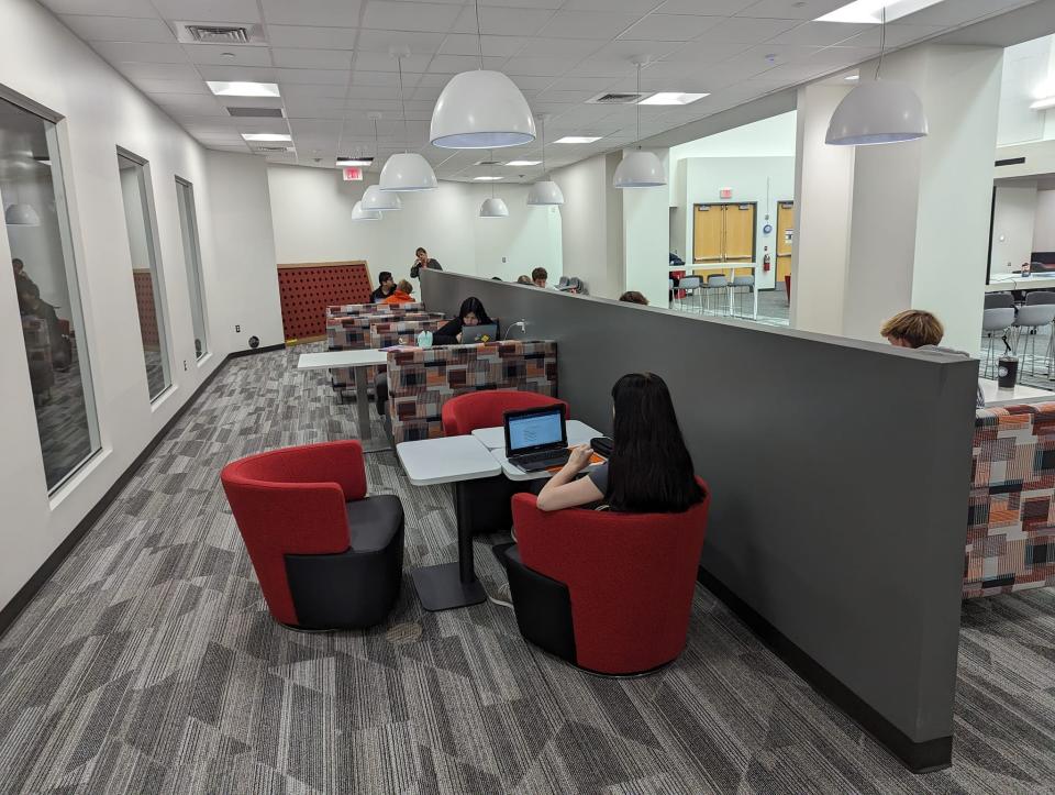 Students work in the newly renovated Pirate Union inside Pinckney High School.