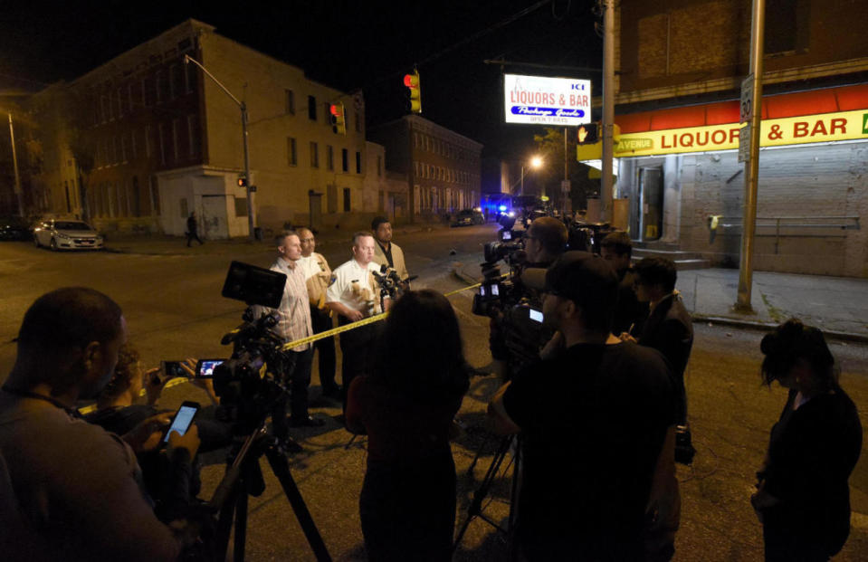 <p>Baltimore police, from left, Deputy Commissioner Dean Palmere, Stanley Brandford, chief of detectives, Commissioner Kevin Davis and T.J. Smith, police spokesman, speak to reporters at a scene where multiple people were shot and wounded in Baltimore, Saturday night, Sept. 24, 2016. The shooting erupted outside some rowhouses about 8:30 p.m. after the three armed men converged on the group from different points, Baltimore Police Commissioner Davis told The Associated Press. (AP Photo/Steve Ruark)</p>