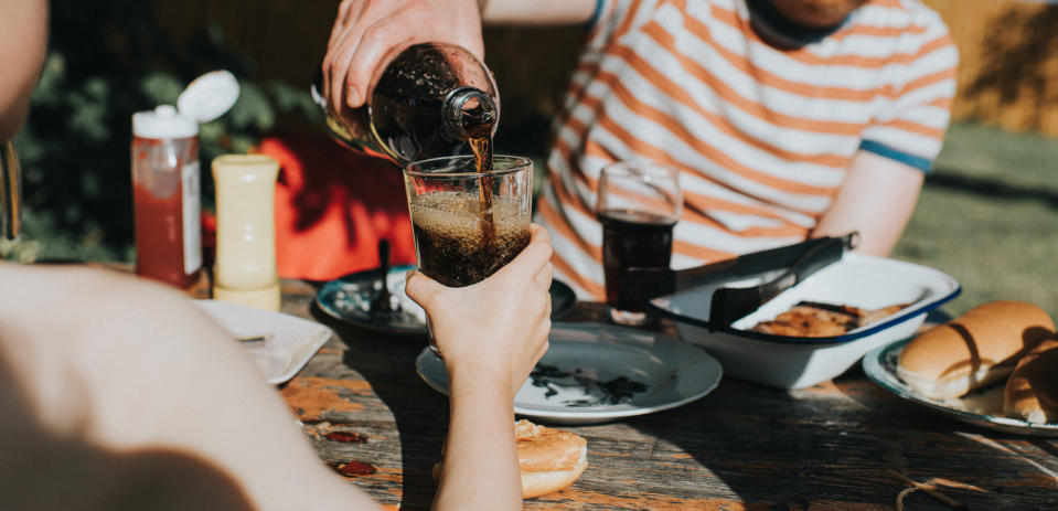 A cup of soda being refilled