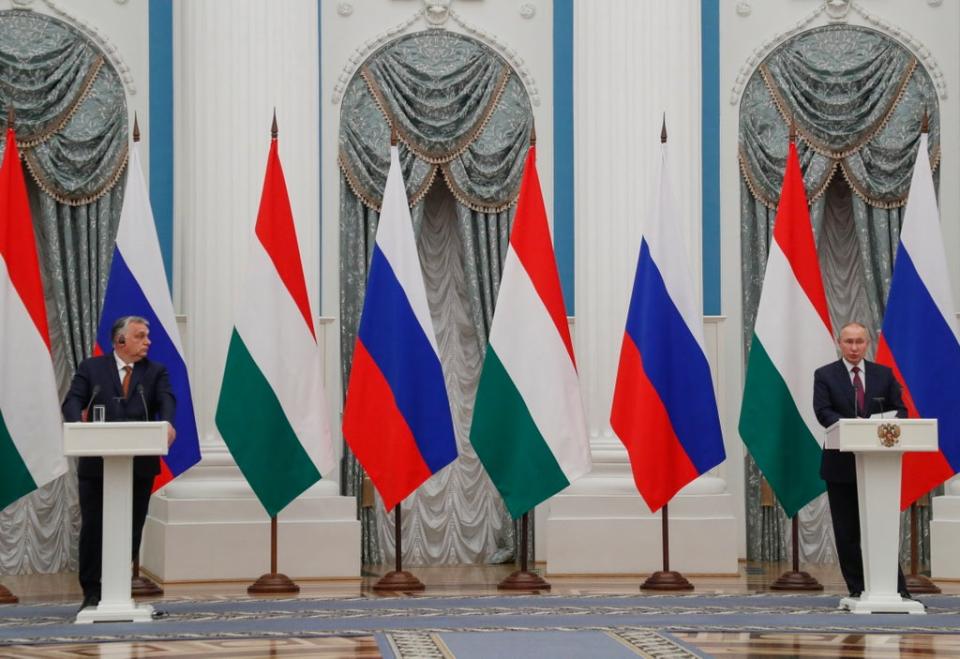 Orban (left) meets with Putin on 1 February (EPA)