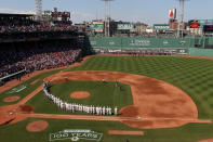 BOSTON, MA - APRIL 20: The New York Yankees and the Boston Red Sox line up on the field in celebration of Fenway Park's 100 years before the game on April 20, 2012 at Fenway Park in Boston, Massachusetts. Today marks the 100 year anniversary of the ball park's opening. (Photo by Elsa/Getty Images)