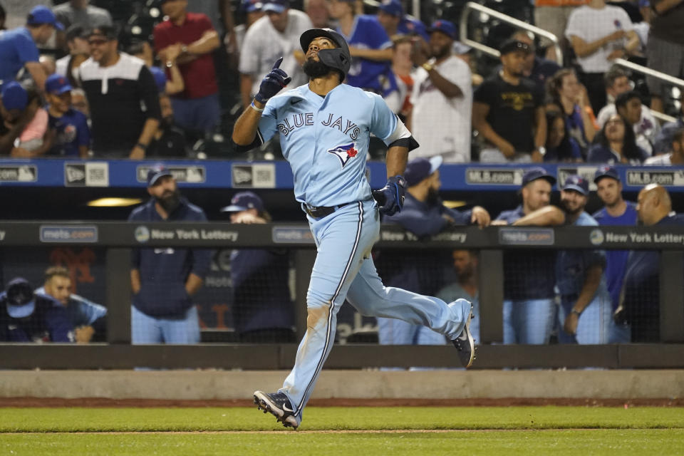 Toronto Blue Jays' Teoscar Hernandez gestures as he runs the bases after hitting a two-run home run during the ninth inning of a baseball game against the New York Mets, Saturday, July 24, 2021, in New York. (AP Photo/Mary Altaffer)