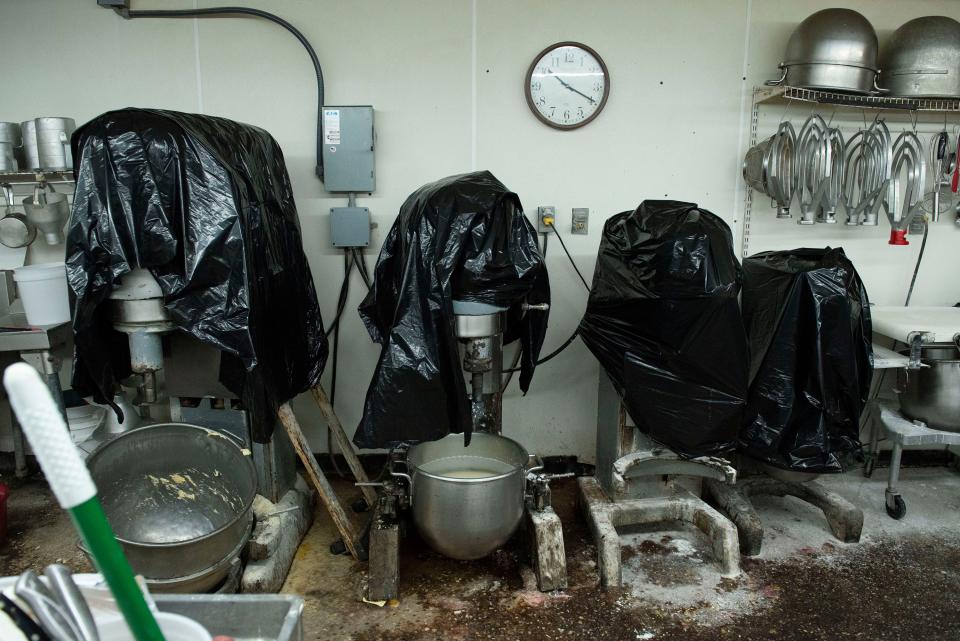 Plastic protects the equipment inside the Milton Quality Bakery after a storm on Sunday caused damage to the popular shop.