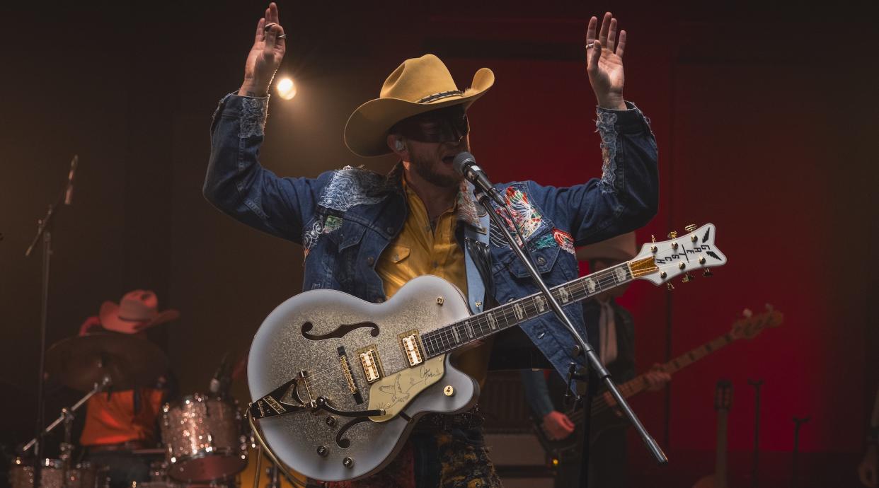  Orville Peck performs onstage with his new signature Gretsch Falcon. 