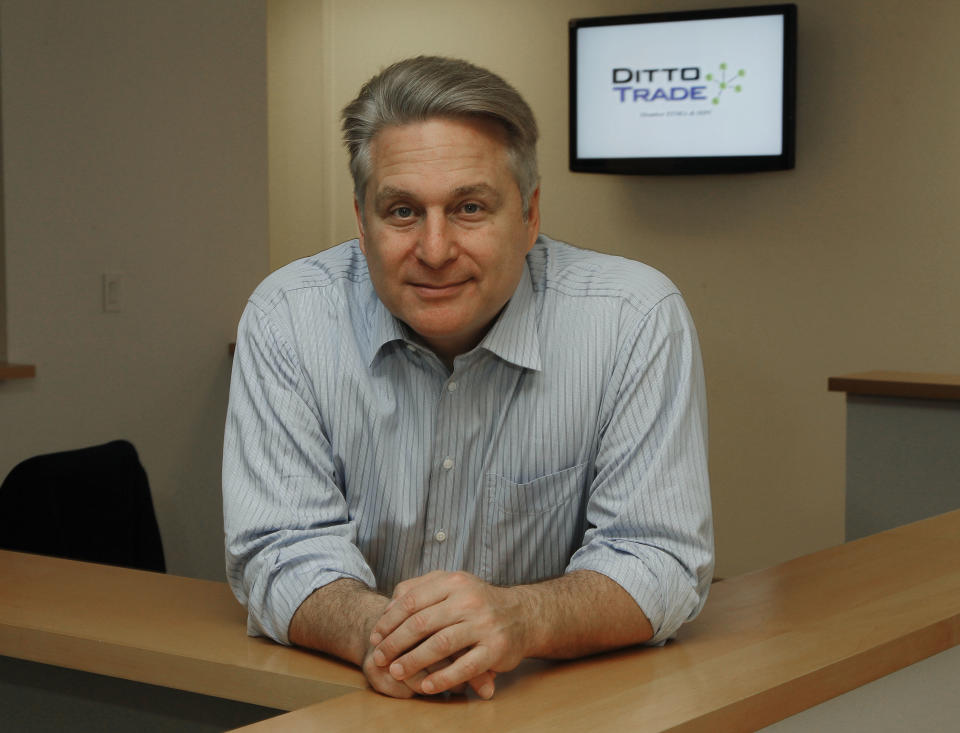 In this Sept. 12, 2012, photo, Joe Fox, CEO of Ditto Trade, poses in his offices in Los Angeles. Ditto Trade is a new online brokerage firm where one can attach their stock portfolio to that of person they trust, so that when they make a trade, so will you. (AP Photo/Reed Saxon)