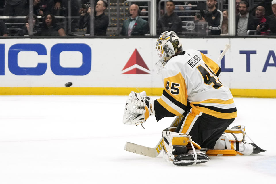 Pittsburgh Penguins goaltender Magnus Hellberg stops a shot during the third period of an NHL hockey game against the Los Angeles Kings Thursday, Nov. 9, 2023, in Los Angeles. (AP Photo/Mark J. Terrill)