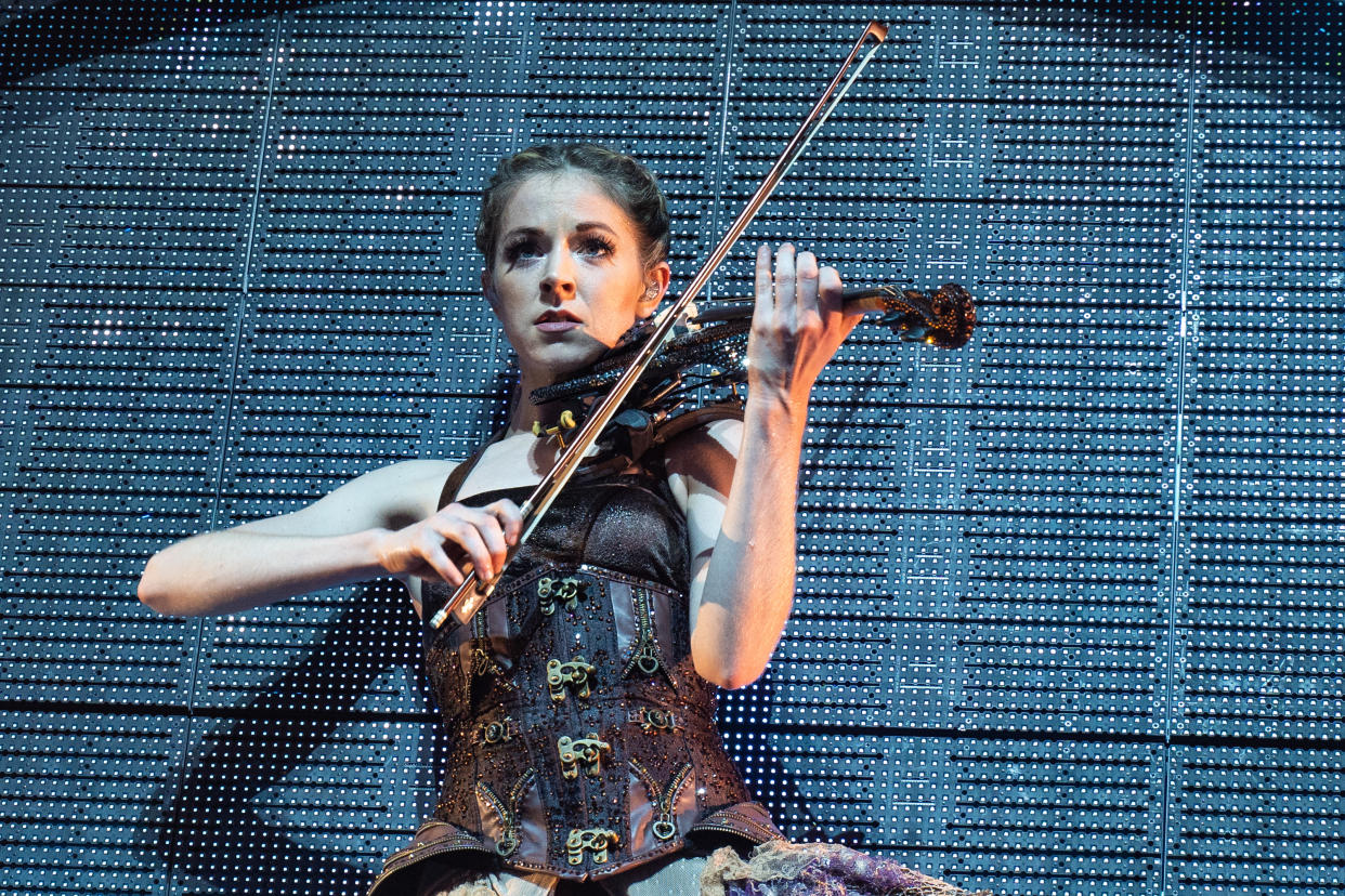 LONDON, ENGLAND - OCTOBER 14: Lindsey Stirling performs on stage at Eventim Apollo on October 14, 2019 in London, England. (Photo by Lorne Thomson/Redferns)