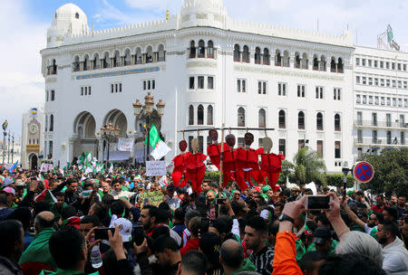 People take part in a protest seeking the departure of the ruling elite, as the country prepare for presidential election in Algiers, Algeria April 12, 2019. REUTERS/Ramzi Boudina