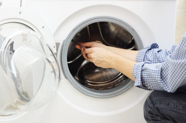 handyman repairing a washing...