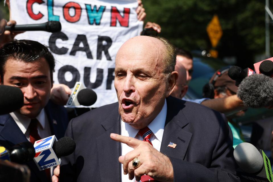 Rudy Giuliani speaks to the media after leaving the Fulton County jail on August 23, 2023 in Atlanta, Georgia.