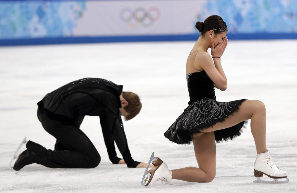 Elena Ilinykh and Nikita Katsalapov of Russia react as they complete their routine in the ice dance free dance figure skating finals at the Iceberg Skating Palace during the 2014 Winter Olympics, Monday, Feb. 17, 2014, in Sochi, Russia. (AP Photo/Darron Cummings, File)