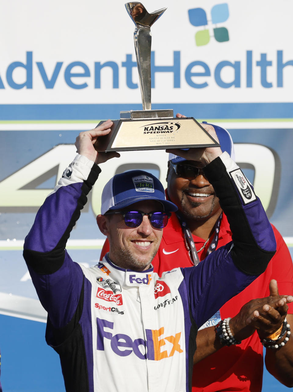 Denny Hamlin celebrates in Victory Lane after winning a NASCAR Cup Series auto race at Kansas Speedway in Kansas City, Kan., Sunday, May 7, 2023. (AP Photo/Colin E. Braley)