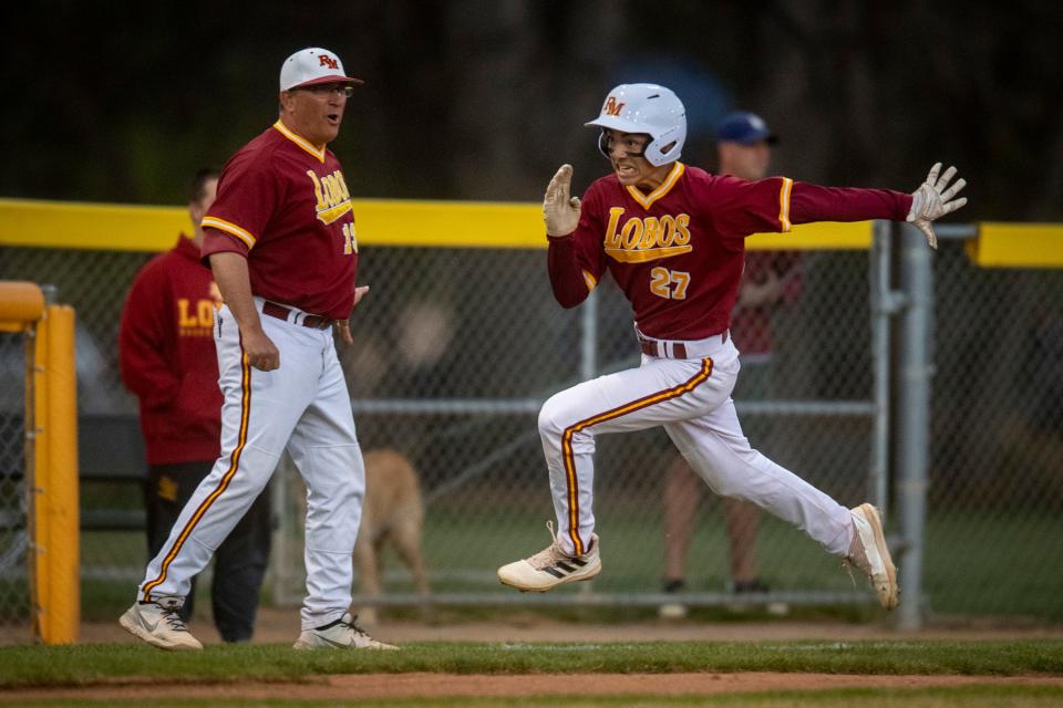 Rocky Mountain High School's Kirin Lawing rounds third base to score a run against Fort Collins High School during their baseball game at City Park in Fort Collins on April 28, 2022.