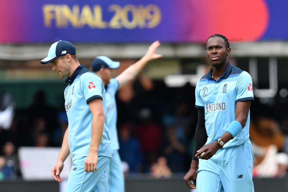 England's Jofra Archer (R) celebrates taking the wicket of New Zealand's Matt Henry for four runs during the 2019 Cricket World Cup final between England and New Zealand at Lord's Cricket Ground in London on July 14, 2019. (Photo by Paul ELLIS / AFP) / RESTRICTED TO EDITORIAL USE        (Photo credit should read PAUL ELLIS/AFP/Getty Images)