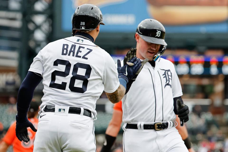 Tigers designated hitter Javier Baez and first baseman Spencer Torkelson celebrate after scoring in the first inning against the Orioles in the first game of the doubleheader on Saturday, April 29, 2023, at Comerica Park.
