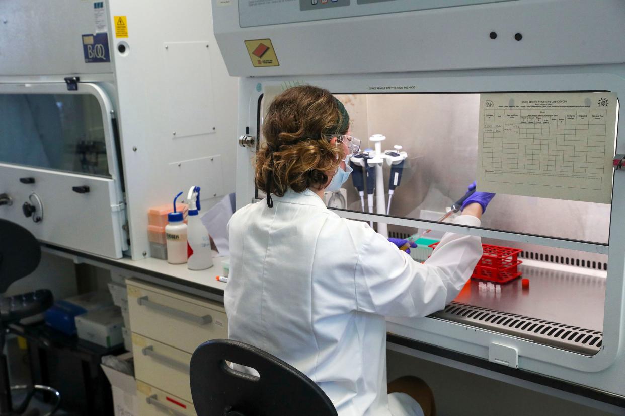 A scientist is pictured working during a visit by Britain's Prince William, Duke of Cambridge (unseen), to Oxford Vaccine Group's laboratory facility at the Churchill Hospital in Oxford, west of London on June 24, 2020, on his visit to learn more about the group's work to establish a viable vaccine against coronavirus COVID-19. (Photo by Steve Parsons / POOL / AFP) (Photo by STEVE PARSONS/POOL/AFP via Getty Images)