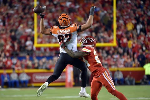 Kansas City Chiefs defensive back Jordan Lucas (24) breaks up a pass intended for Cincinnati Bengals tight end C.J. Uzomah (87) during the second half of an NFL football game in Kansas City - Credit: AP Photo/Ed Zurga