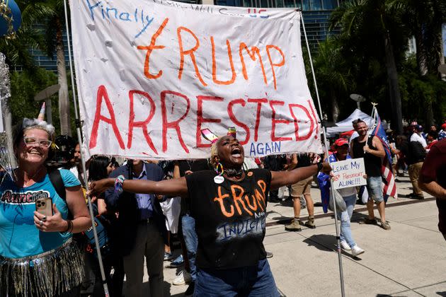 Nabine Seiler holds a sign that reads 